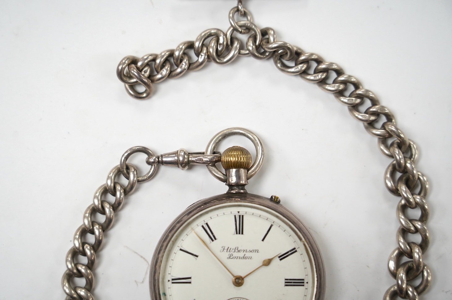 A late Victorian silver open face pocket watch, by J.W. Benson, with Roman dial and subsidiary seconds, together with a silver albert. Condition - poor to fair